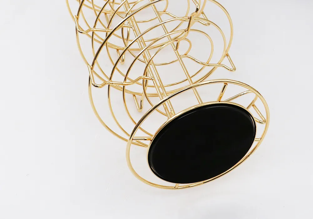 Porta cápsulas giratorio con estructura de metal dorado y base circular, para Dolce Gusto