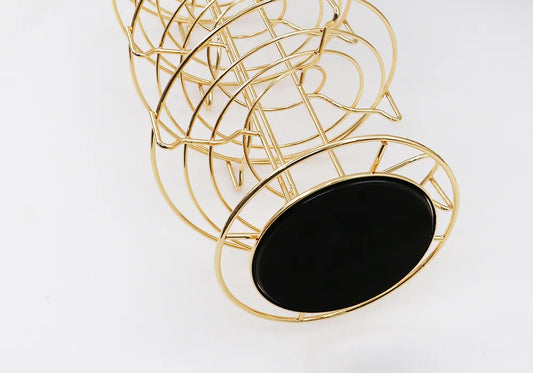Porta cápsulas giratorio con estructura de metal dorado y base circular, para Dolce Gusto