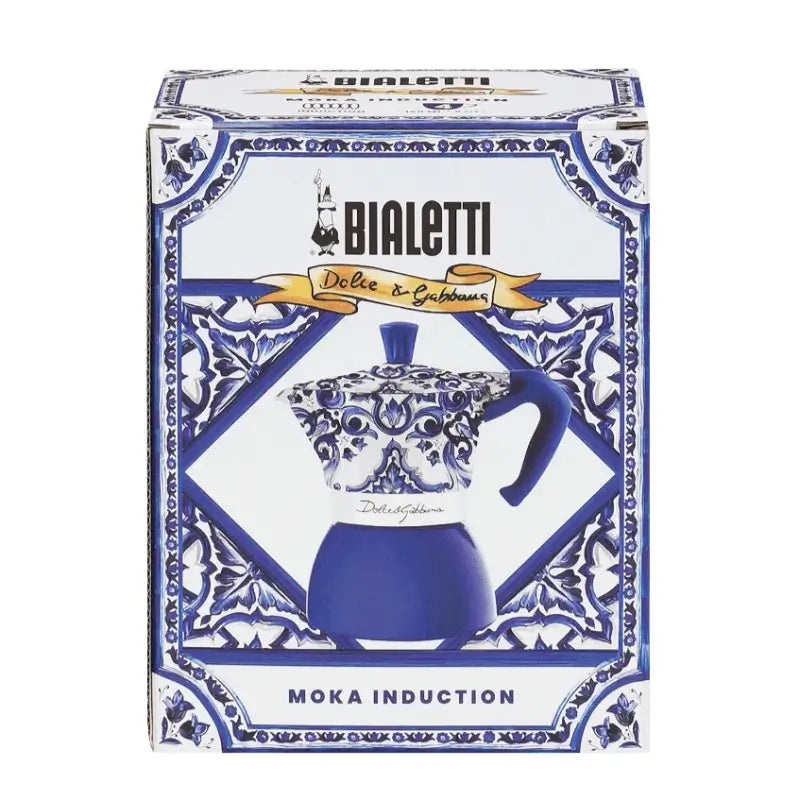 Caja de cafetera moka de inducción Bialetti azul y blanca con motivo Dolce&Gabbana.