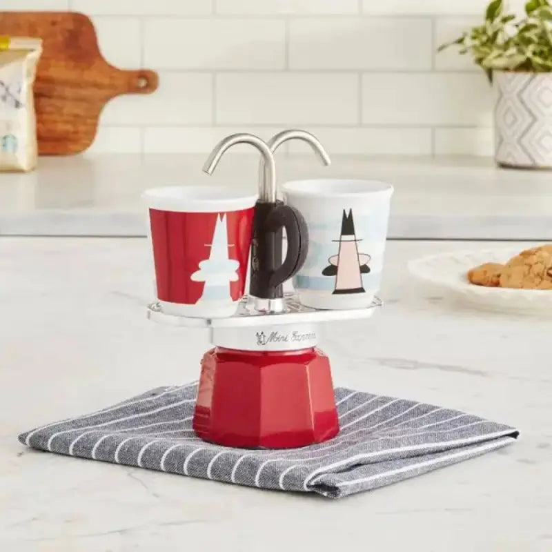 Cafetera moka Mini Express Bialetti roja con 2 vasos blanco y rojo