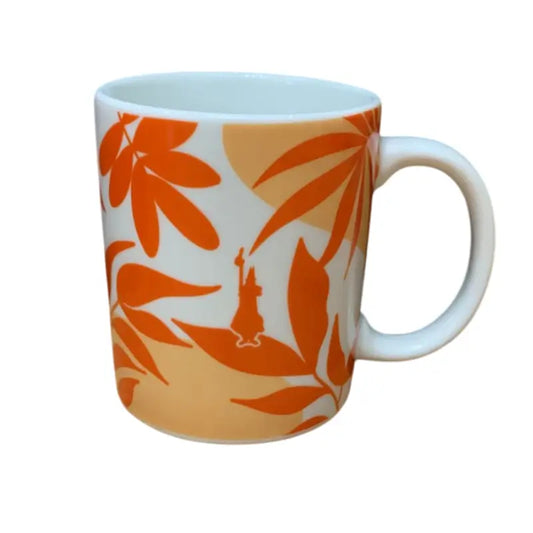 Taza de cerámica Bialetti naranja con estampado floral y asa blanca