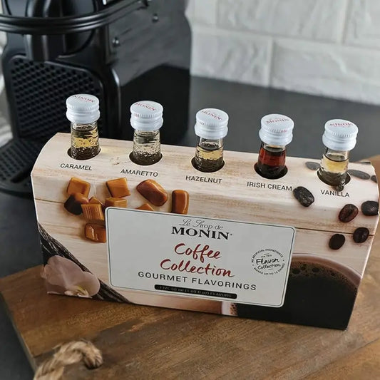 Set de jarabes MONIN Coffee Collection con 5 botellitas; sabores visibles como caramelo y vainilla